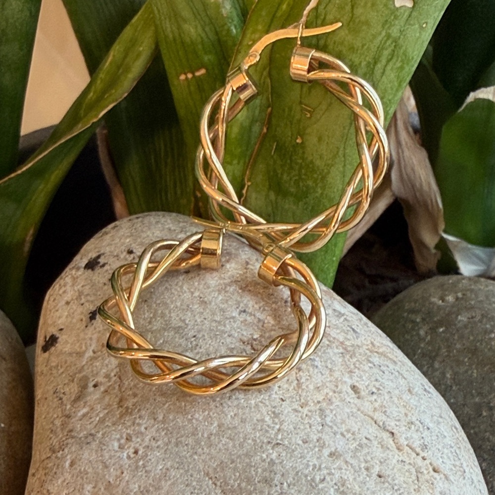 Sold.     14 karat gold, twisty hoops
